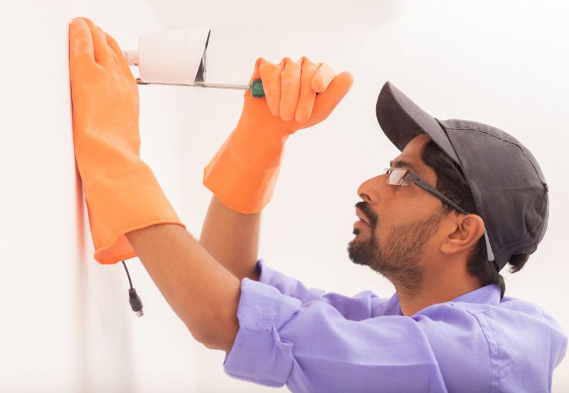 Technician Inspecting Camera